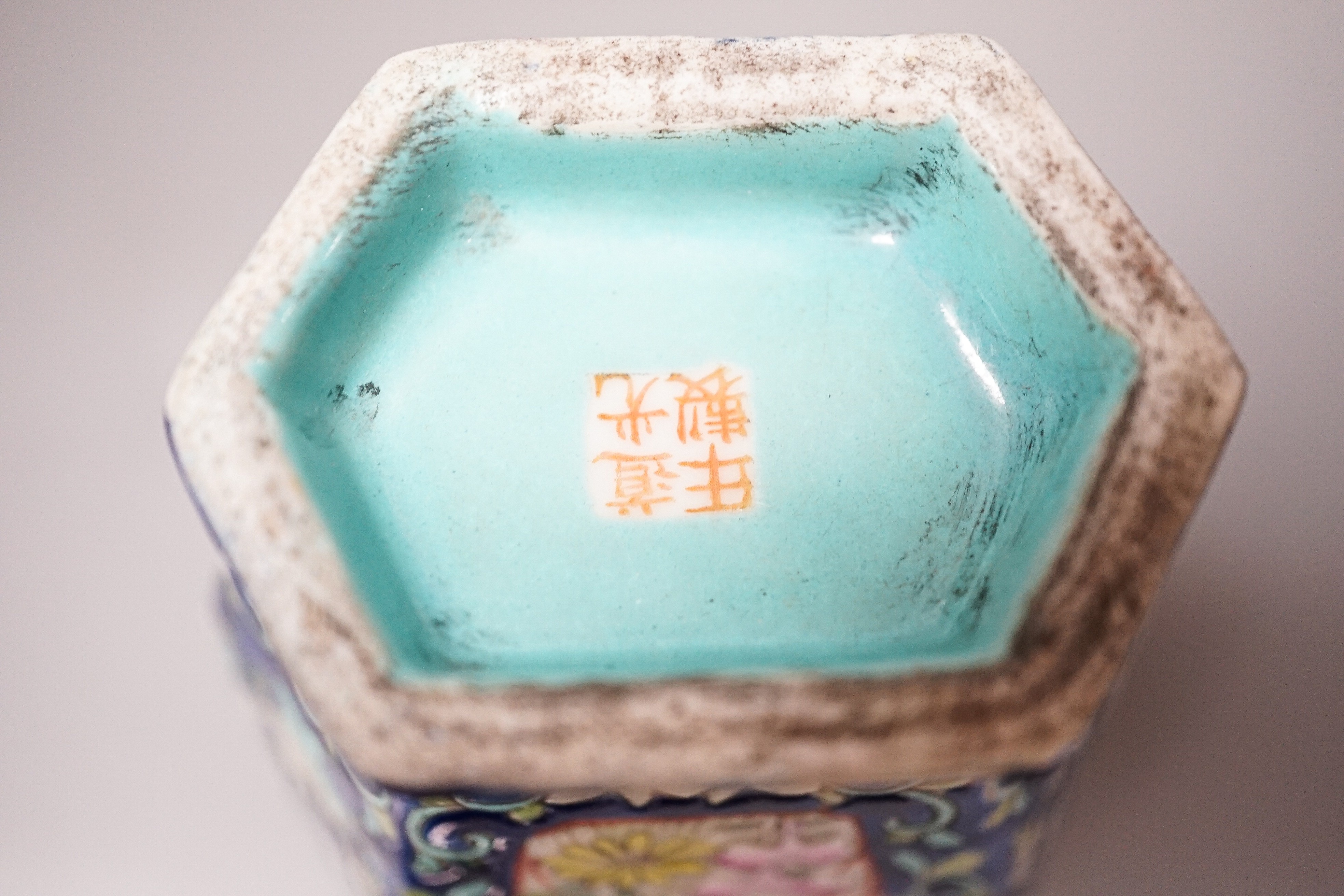 A Chinese blue ground famille rose hexagonal vase, late 19th century, 15cm